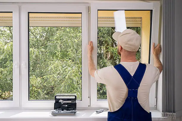 Crew replacing aging living room windows in occupied Tenino family home, Technician repairing broken sliding window latch in occupied Yelm home